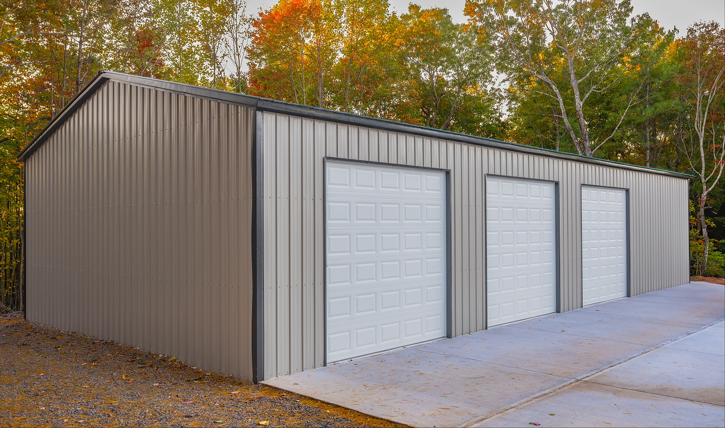 Custom steel garage with roll-up doors built by US Erectors Metal Structures.
