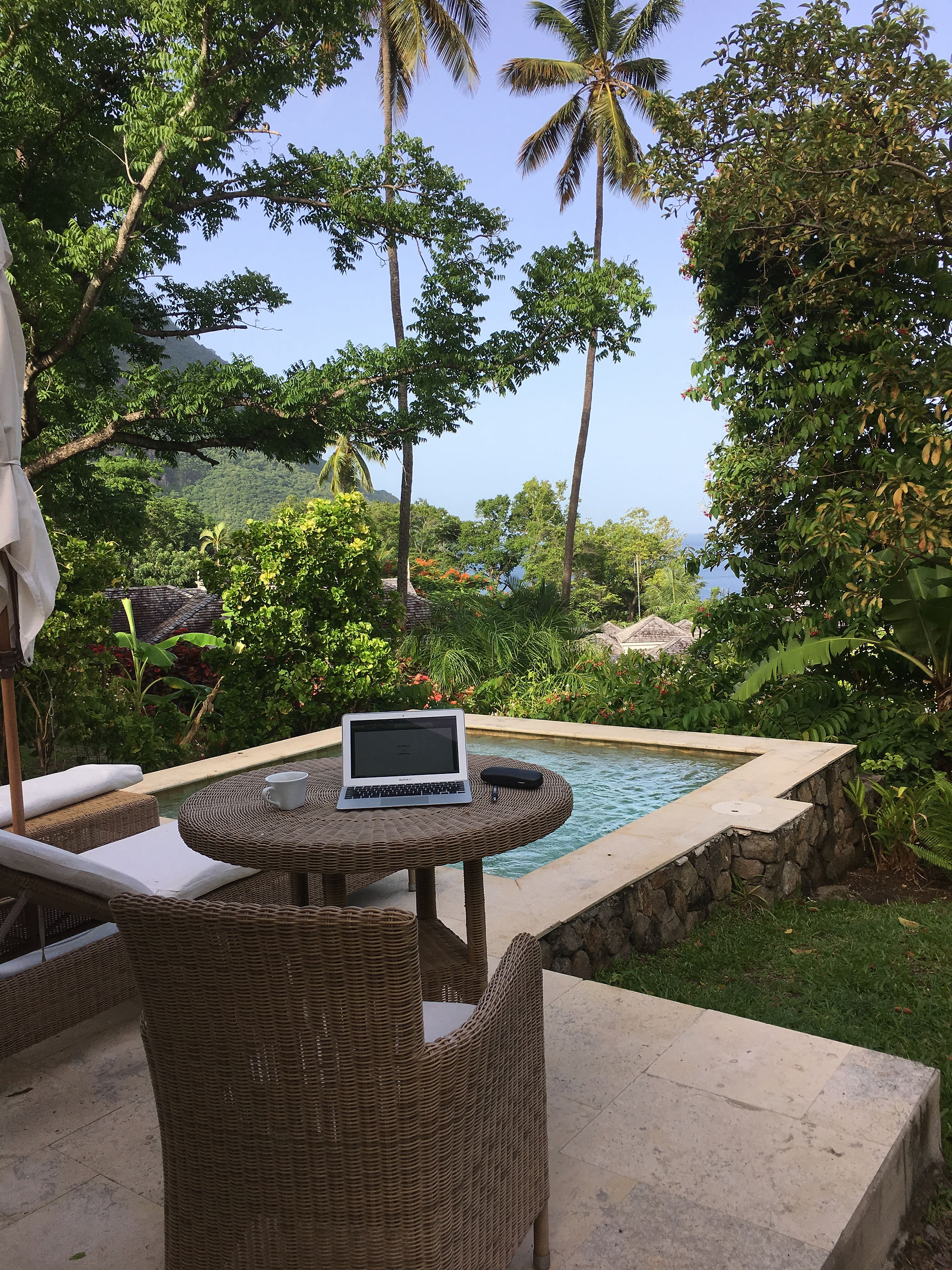 Charlie's work station outside of Villa 306 at Sugar Beach Resort. Pitons Bay in the Distance.