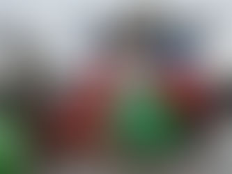 Coast Guard crewmen handle red and green buoys on a boat in the Port of Baltimore.