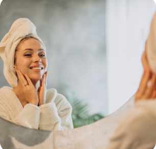 A woman washes her face