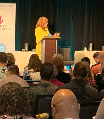 Dr. Deborah Egerton at the 2023 IEA Conference, San Francisco giving her Keynote address and introducing her book "Know Justice Know Peace"