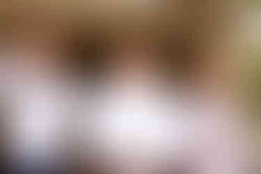 three white men smiling and putting on bow ties in Lititz Pennsylvania