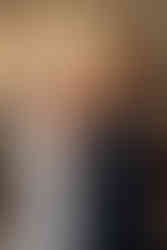 Bride with her mom zipping up a white wedding dress looking at each other at Excelsior in Lancaster Pennsylvania