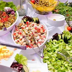 Outdoor catering setup: "Outdoor barbecue and seafood catering in a beautiful garden setting at an Orlando wedding."
