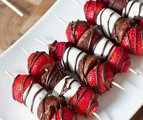 Decadent dessert bar: "Selection of desserts on a stylish dessert bar for wedding guest in orlando