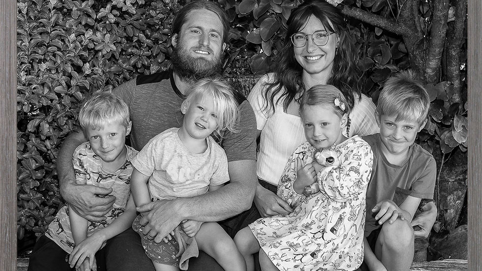Family Portrait outdoors, smiles and attention from all family members