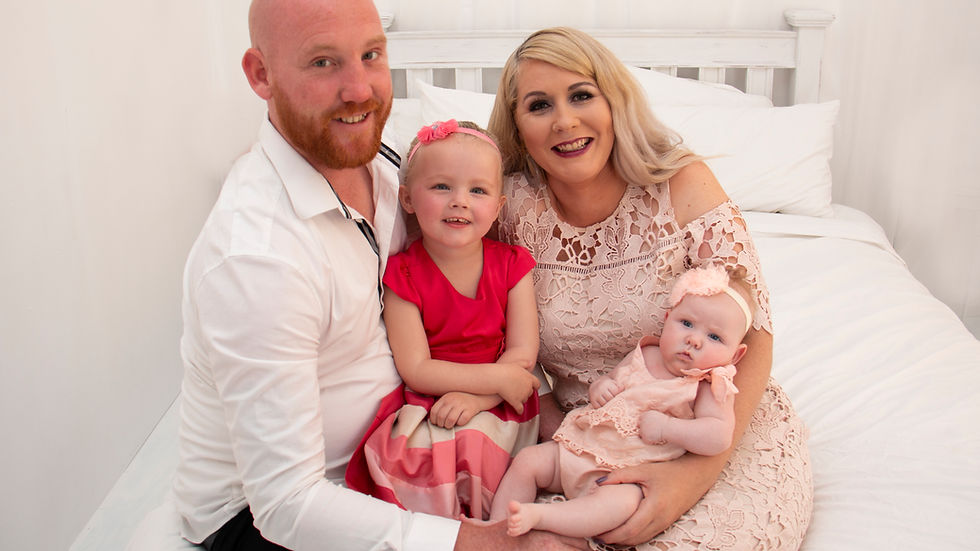 Coordinated family outfits in soft tones