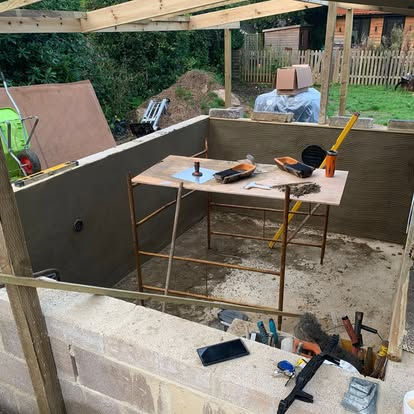 Rendered structural walls during construction of the swim spa