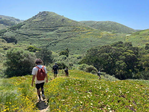 Hiking through the green mountains of Cabo da Roca, the westernmost point of continental Europe, near Vivenda Felicidade coliving in Sintra, Lisbon, Portugal