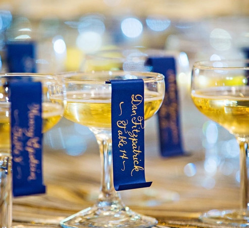 Unique escort cards gold ink on navy paper
