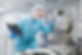 caucasian-scientist-man-blue-lab-suit-make-notes-about-big-steel-chromed-machine-with-tube
