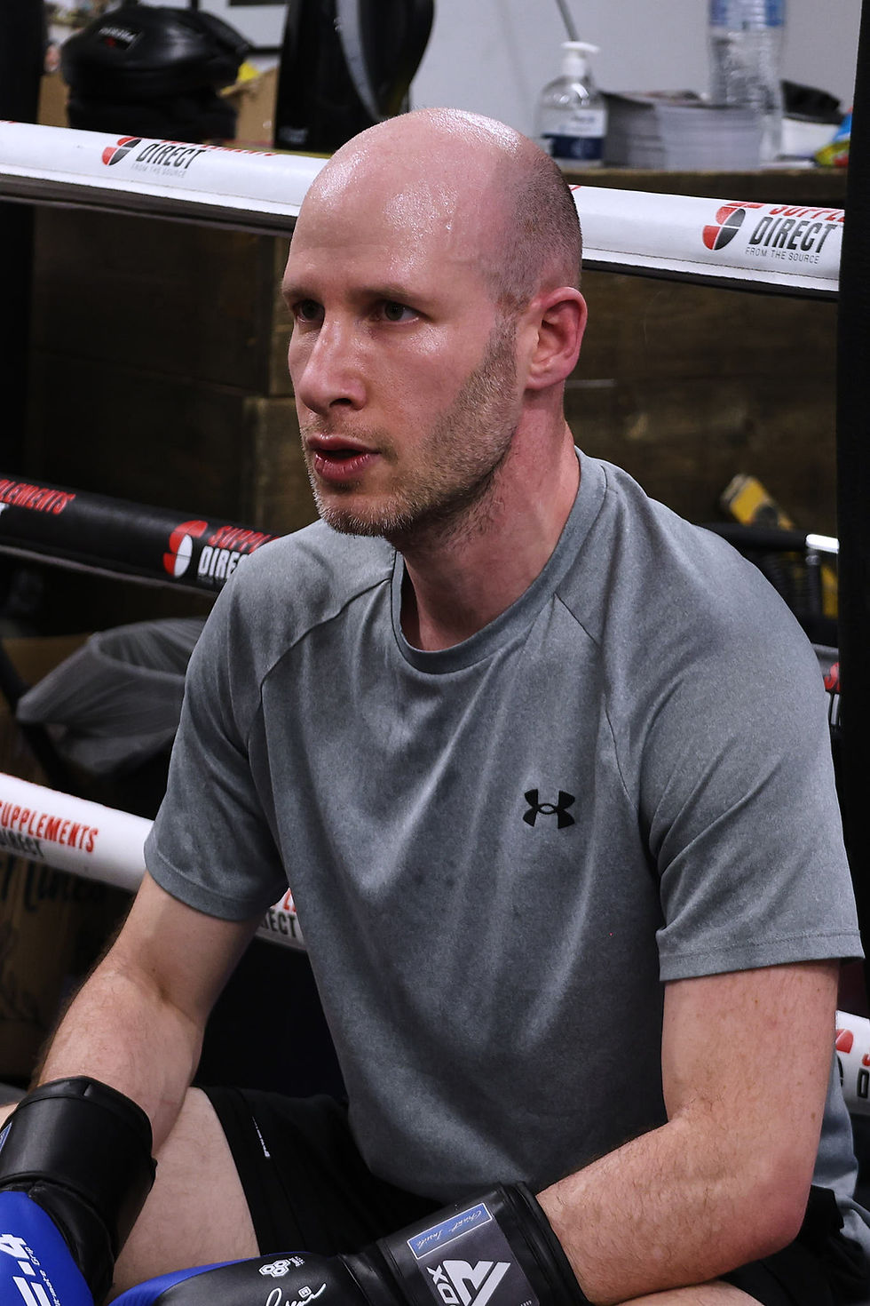 Man in boxing gloves at a Muay Thai class