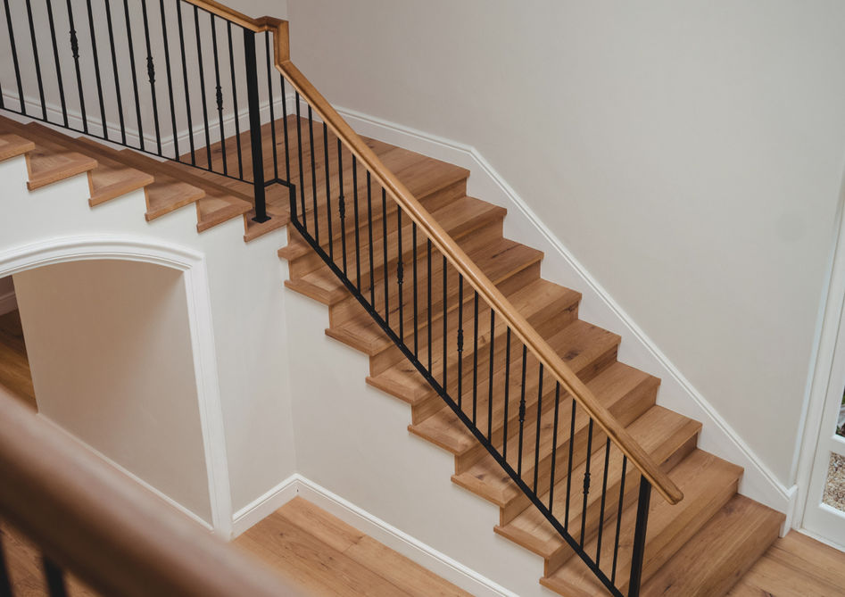 Stair system installation in Greenville, SC | RENOVO featuring hardwood, vinyl, laminate, or sheet vinyl for a seamless and durable finish.