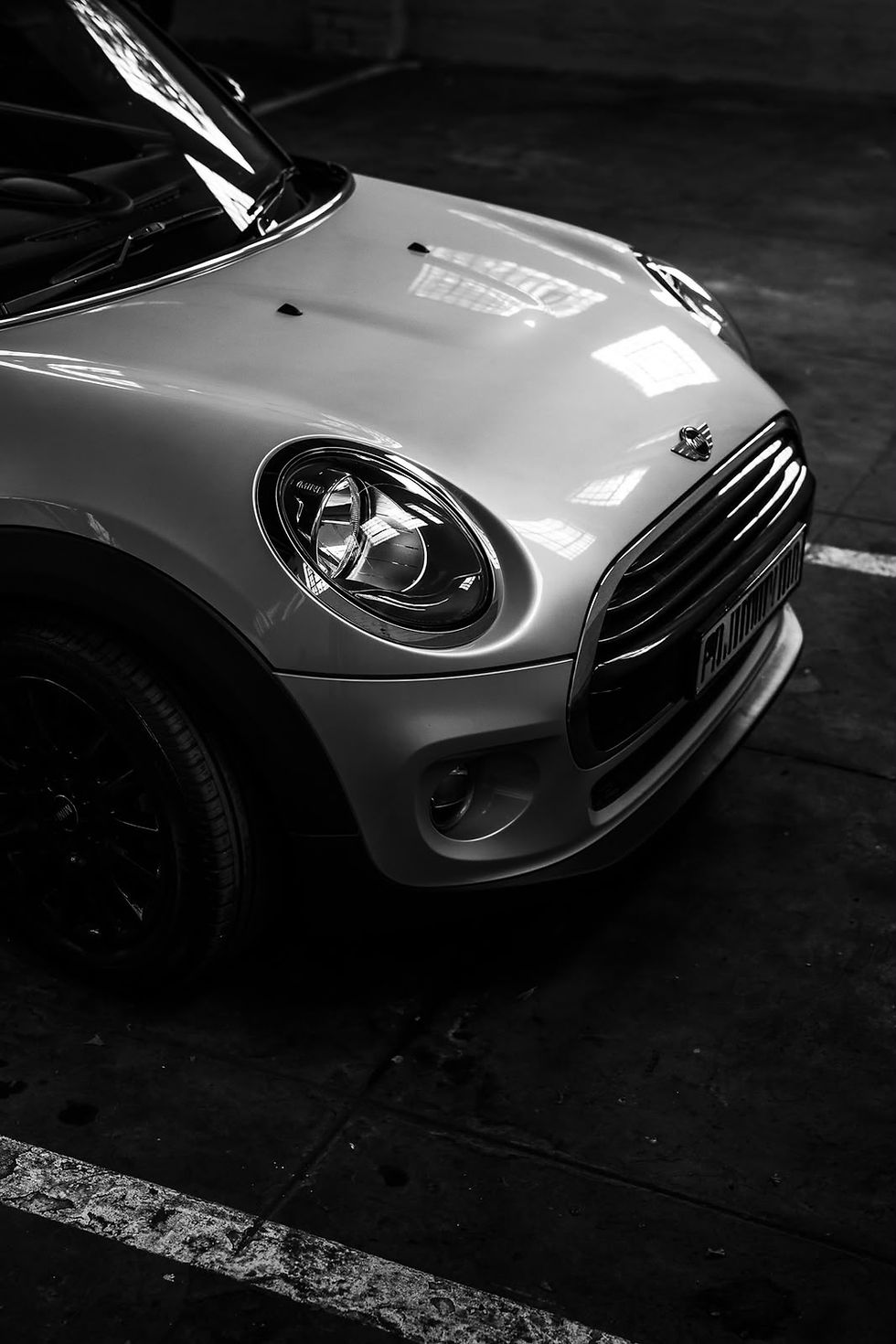Silver MINI car parked on a urban street