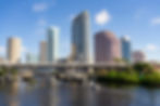 Scenic view of the Tampa Riverwalk and downtown skyline in Tampa, FL.