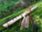 Thumbnail: Handcrafted Native American style flute of Hazel tuned to C 528 Hz on mossy log in forest scene.
