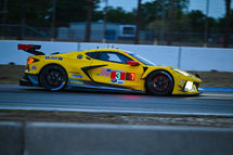 Go to RaCorvette C-7R evening at Sebring International Raceway entering turn 10.cing Venus