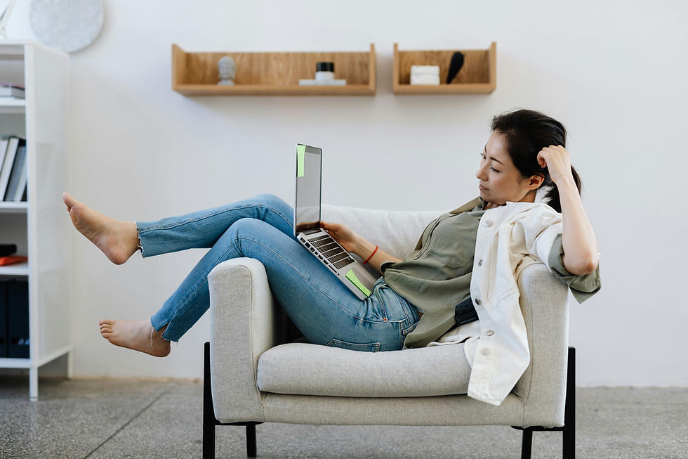 A Virtual Assistant Sitting Comfortable On An Armchair While Working