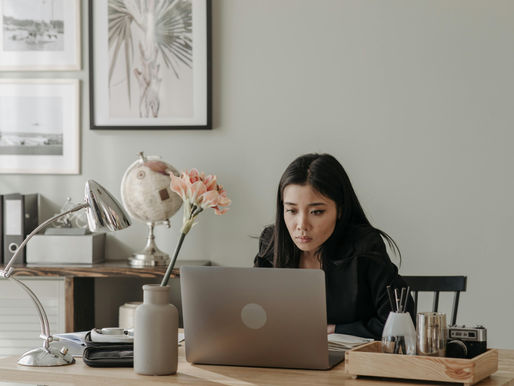 Woman in Black Long Sleeve Shirt Using Laptop