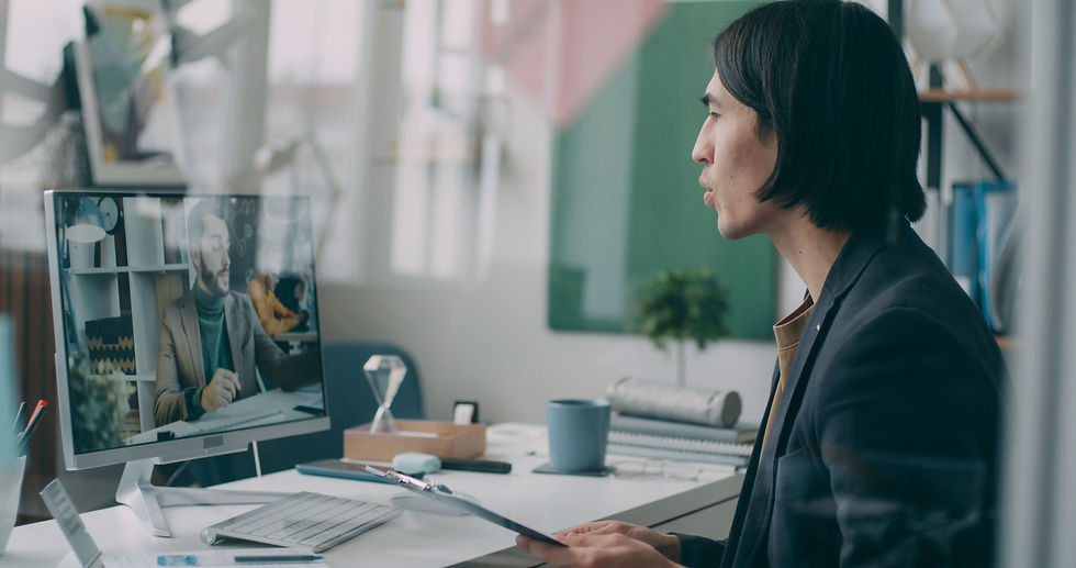 A Virtual Assistant engaged in a video conference in a modern home office setting.