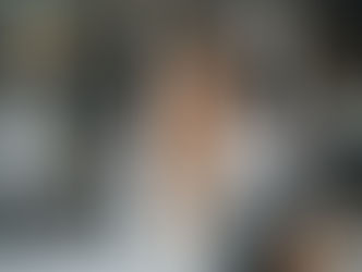 Business Owner Sitting at a Desk and Showing an Okay Sign on a Virtual Assistant on a Tablet