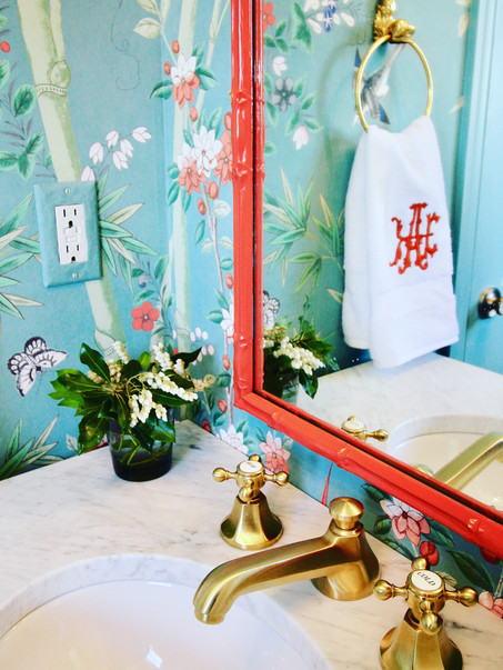 Powder room with colorful wallpaper