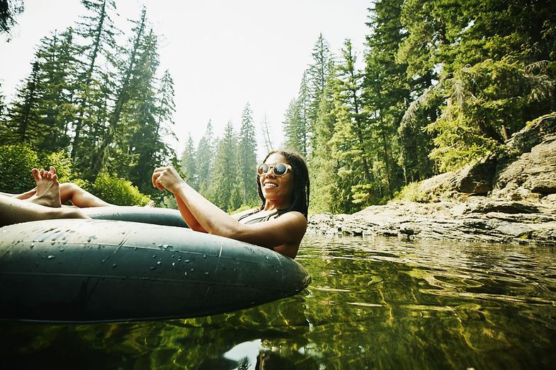Woman Tubing with Float Tube Rental on String Lake, Jackson Hole, Wyoming
