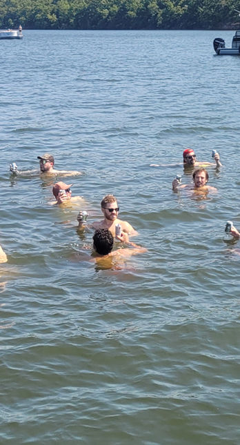 Friends having fun during a Lake of the Ozarks boat charter at Party Cove with a licensed boat captain