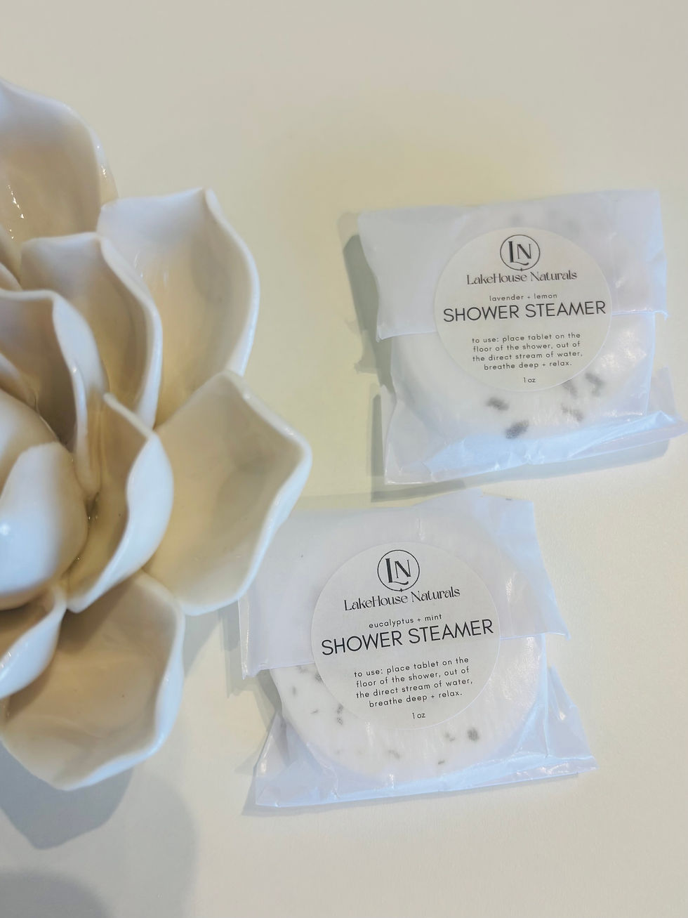 LakeHouse Naturals shower steamers in Eucalyptus + Mint and Lavender + Lemon, side by side