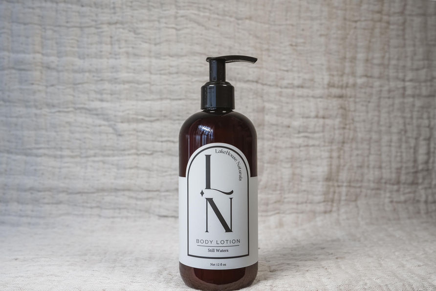 Close-up of LakeHouse Naturals 12 oz body lotion highlighting smooth texture and nourishing, natural formula.