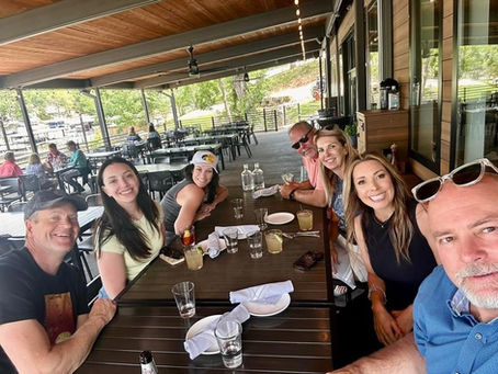 Group enjoying a private meal at The 1932 Reserve waterfront restaurant near Lake of the Ozarks with Captain Bic