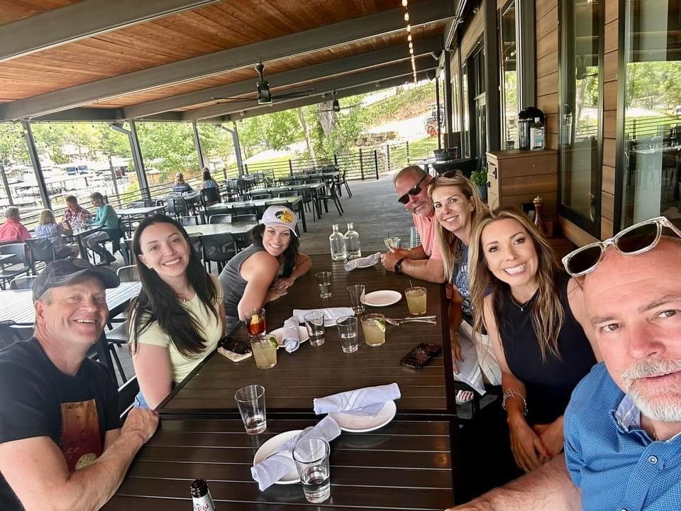 Group enjoying a private meal at The 1932 Reserve waterfront restaurant near Lake of the Ozarks with Captain Bic