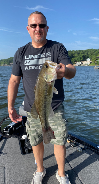 Captain Kirt holding a massive bass caught on Lake of the Ozarks