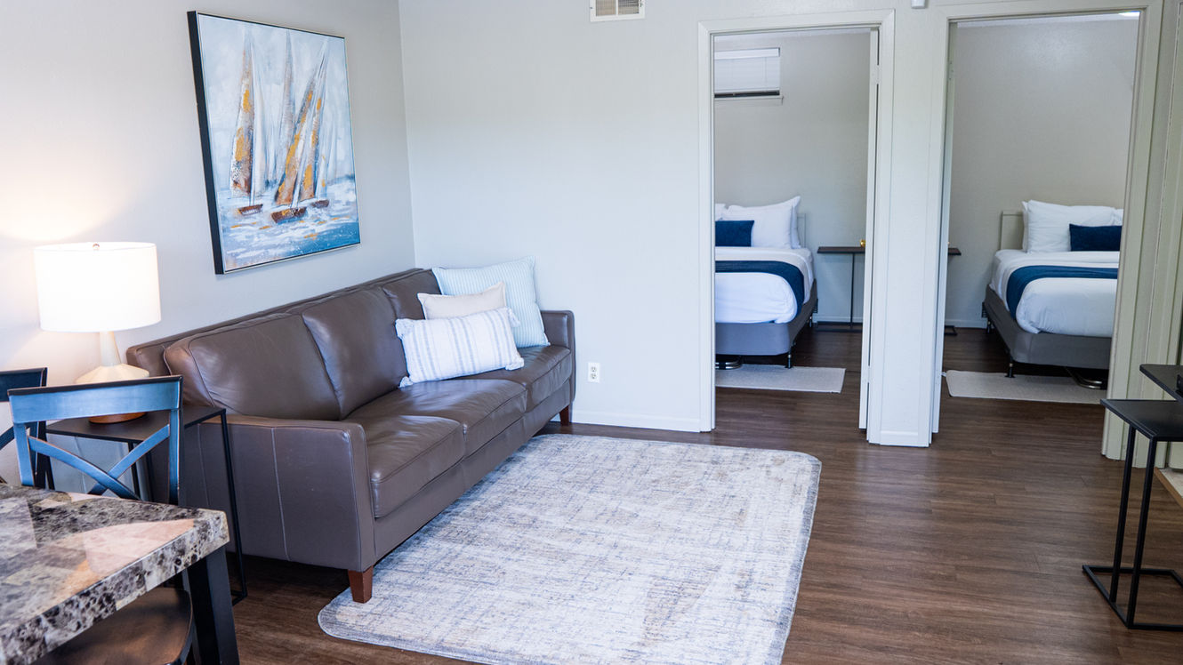 Comfortable living area with TV and sofa in Sunset Beach Resort cabin