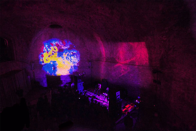 psychedelic rock bands perform in an ancient monument in Italy