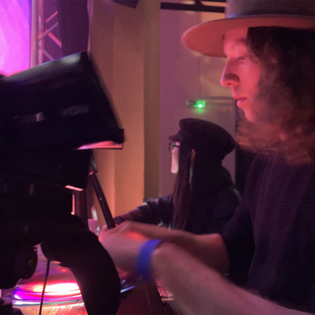 Bands perform with psychedelic projections, liquid light shows, and dancing audience