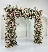 2.4m artificial front coverage floral wedding arch filled with ivory, foliage and blush pink florals to create a stunning full backdrop.