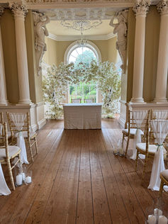Cream Blossom Moongate Arch, Trio of Cylinder Vases and Chair Drapes - Kimberley Hall