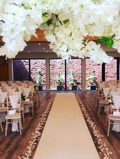 Aisle runner and chair drapes at Reymerston Hall