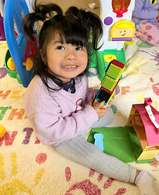 Child expressing creativity through an art activity at Bright Hands Academy