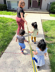Children enjoying a neighborhood walk as part of community exploration at Bright Hands Academy