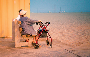Elderly couple sitting at the beach