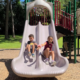 Kids racing down the slide
