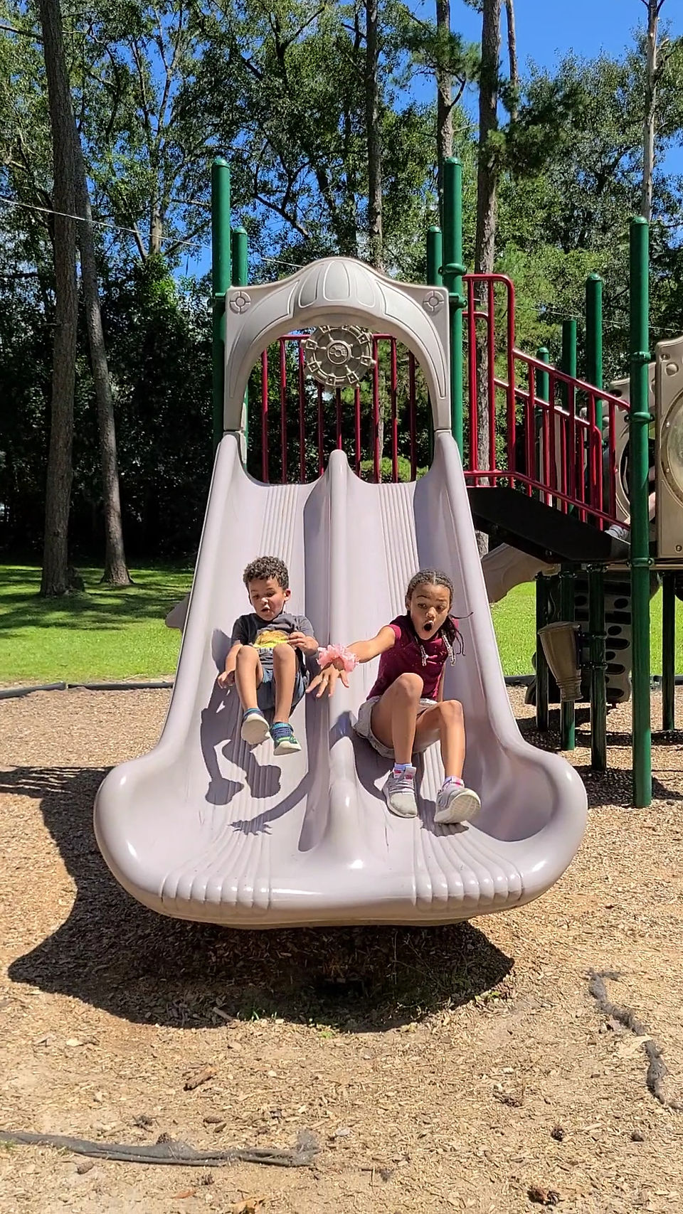 Kids racing down the slide