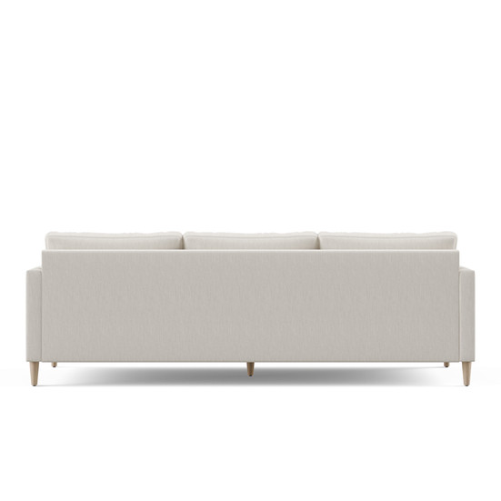 the back of the a tribeca sofa in a white fabric with mid-century modern design