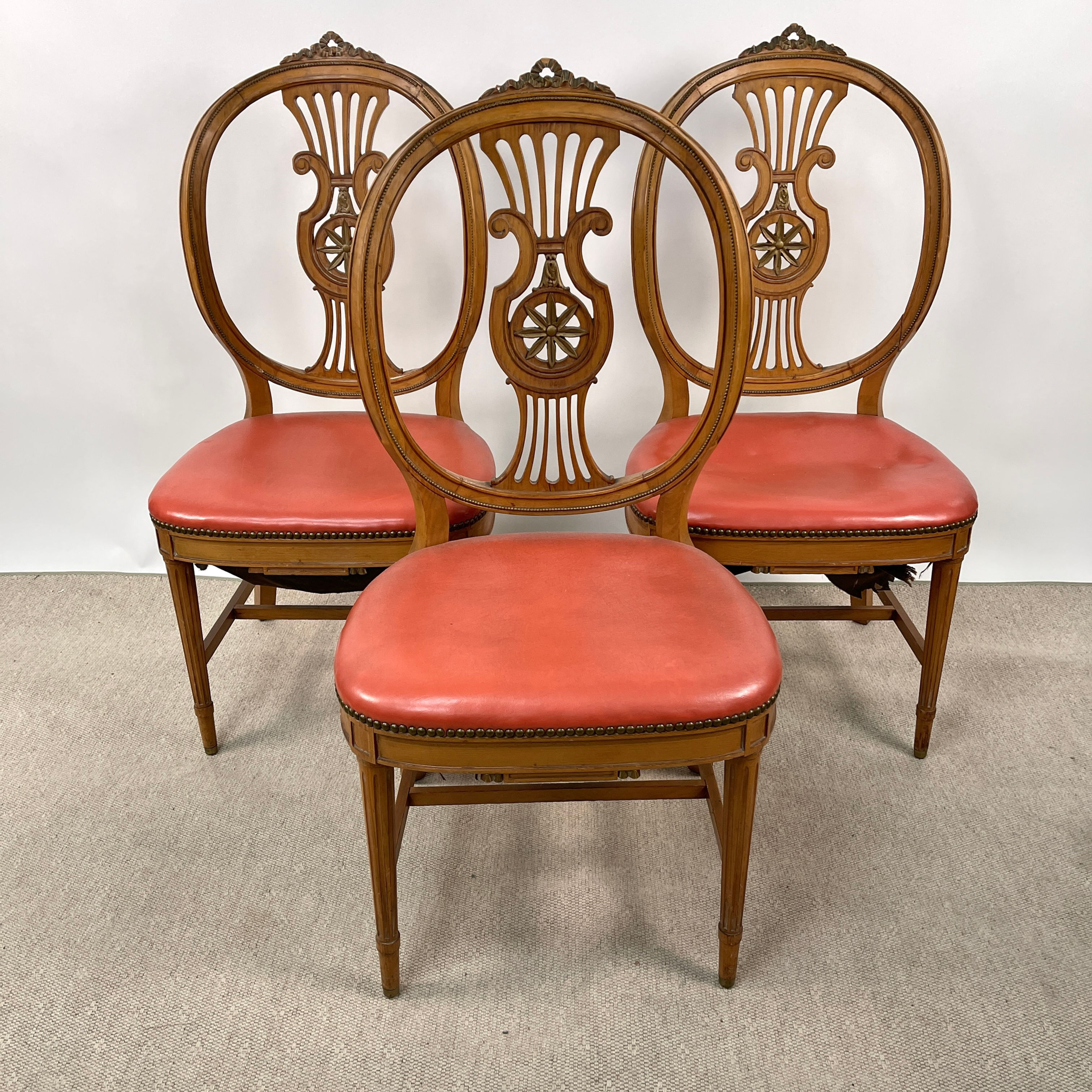 Three Chairs with Salmon Leather  $50 Each