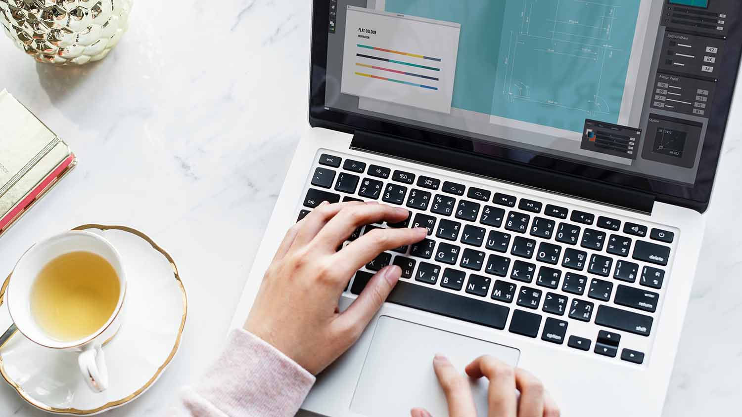 image of a laptop, online driving course being completed taking notes