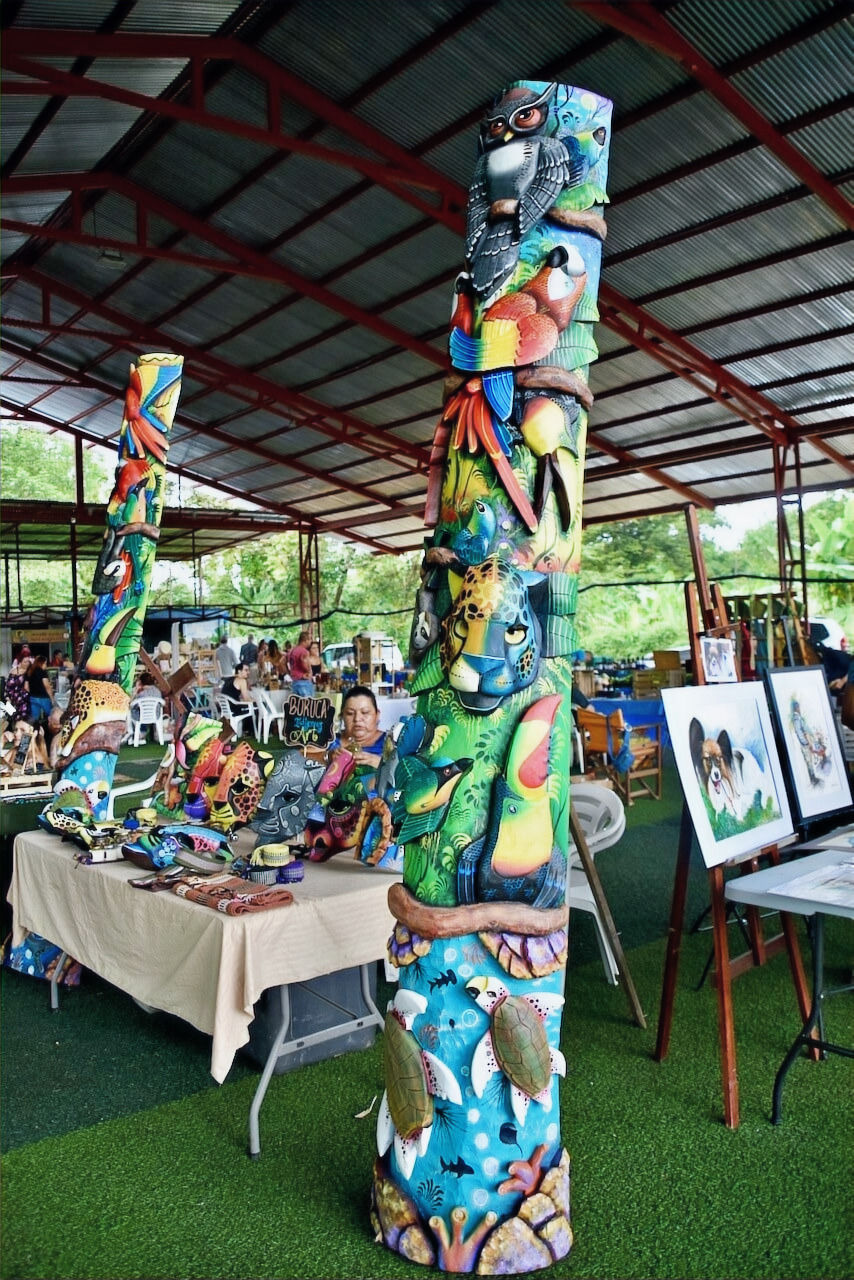 Market showing artisans with masks and paintings