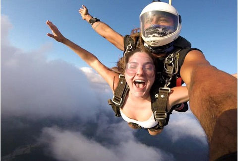 Girl skydiving with a guide