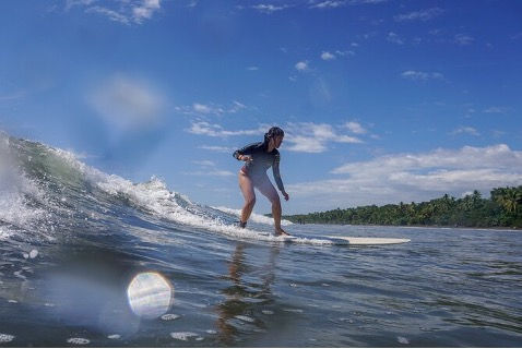 Beginner surfer on a calm wave